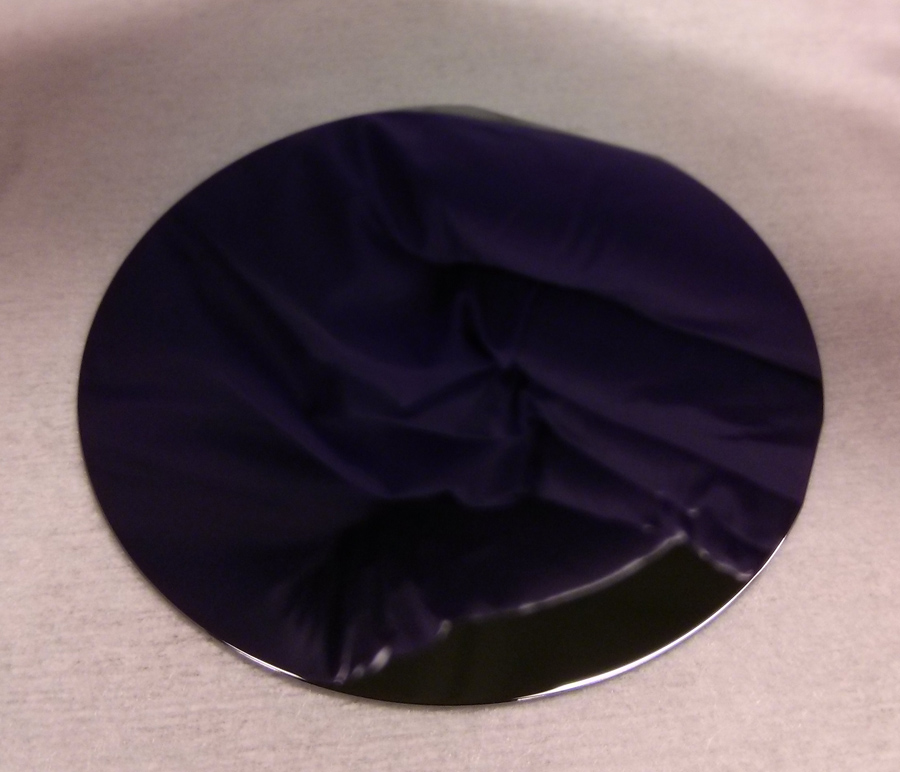 Fabrication of Optical-Quality Facets By Selective Epitaxial Growth